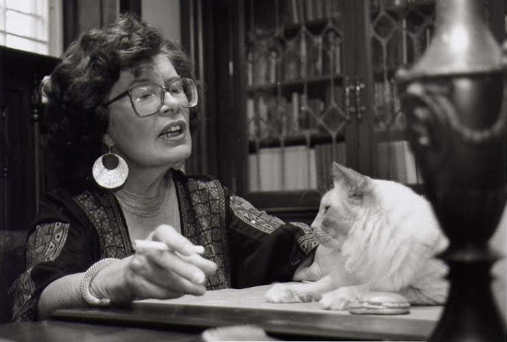 Barbara Michaels at her desk, always stocked with a cigarette and a cat